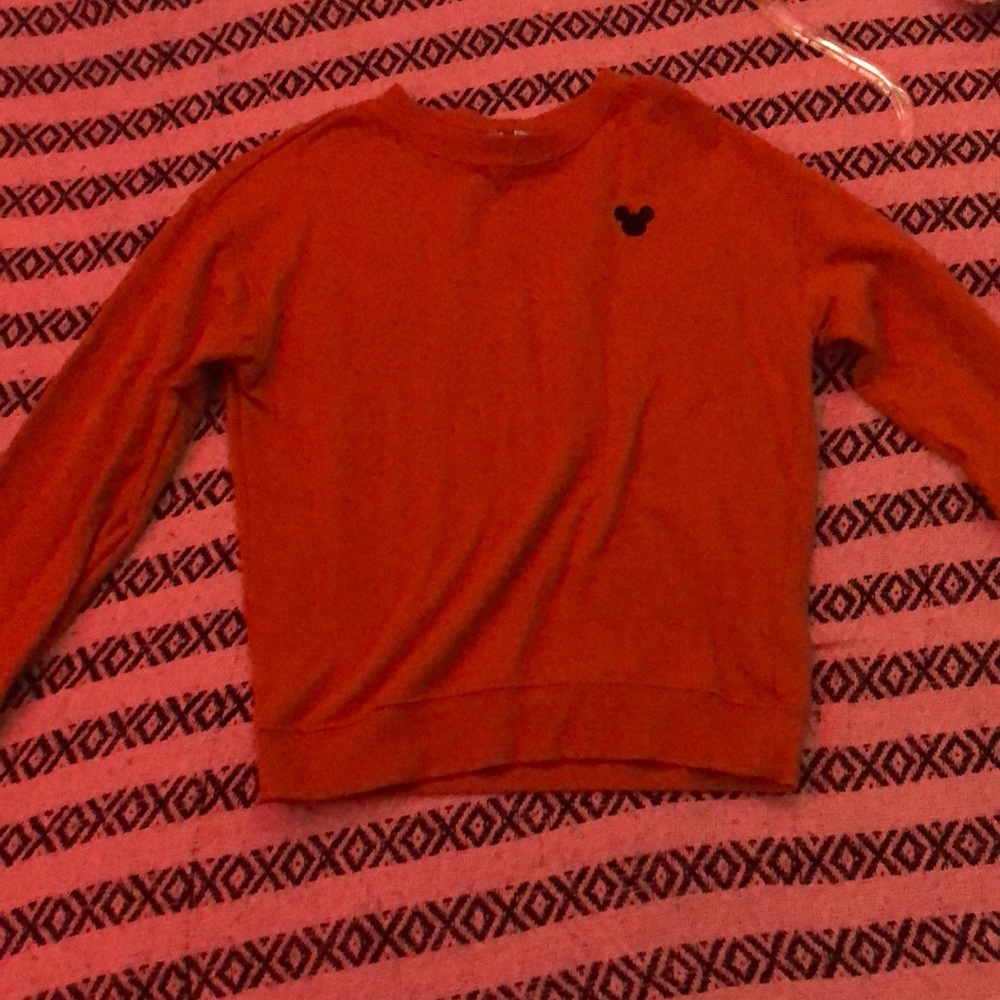 A v neck orange brown with a black Mickey logo